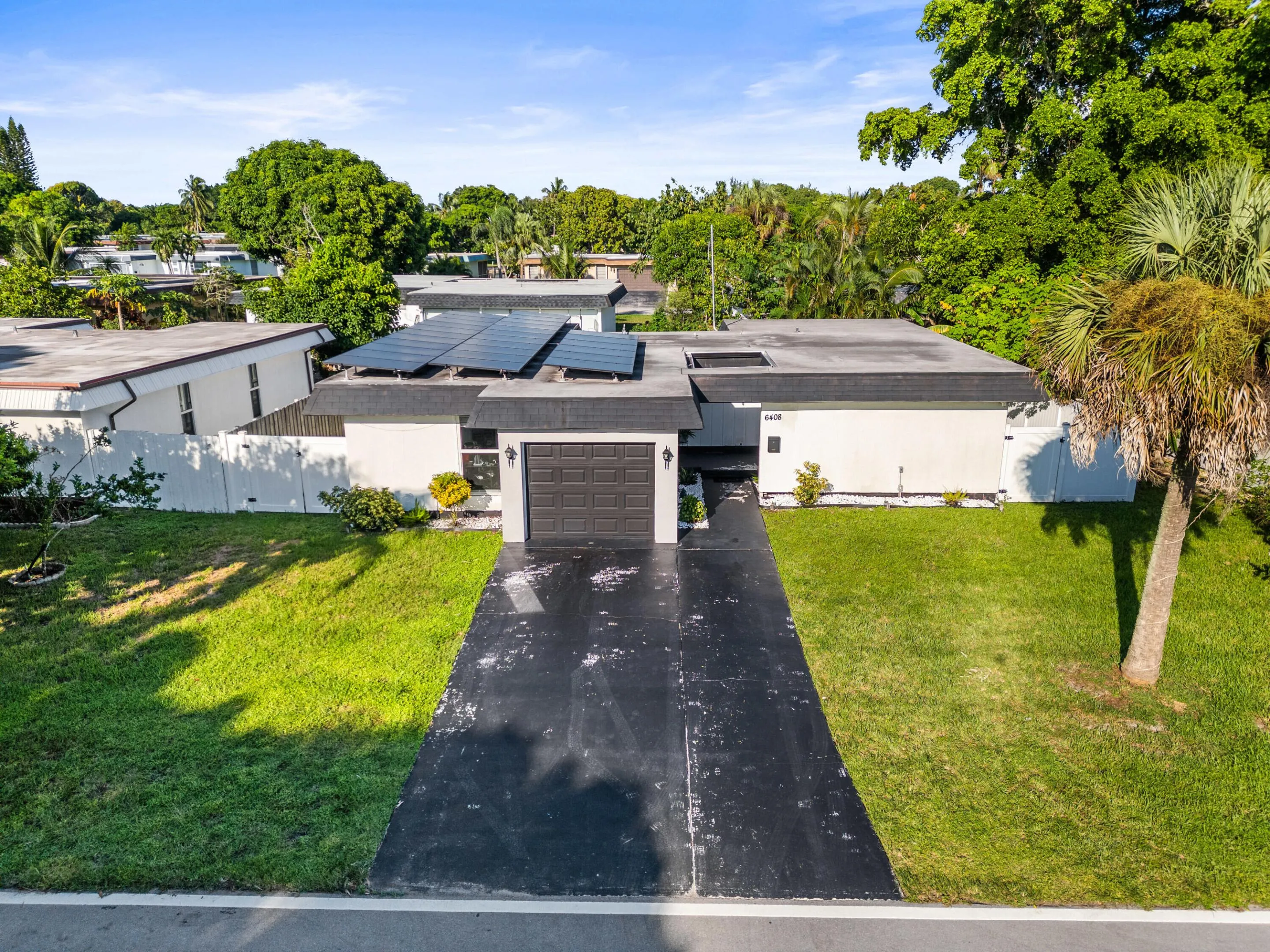 Front Exterior, Spacious Driveway and Solar Panels