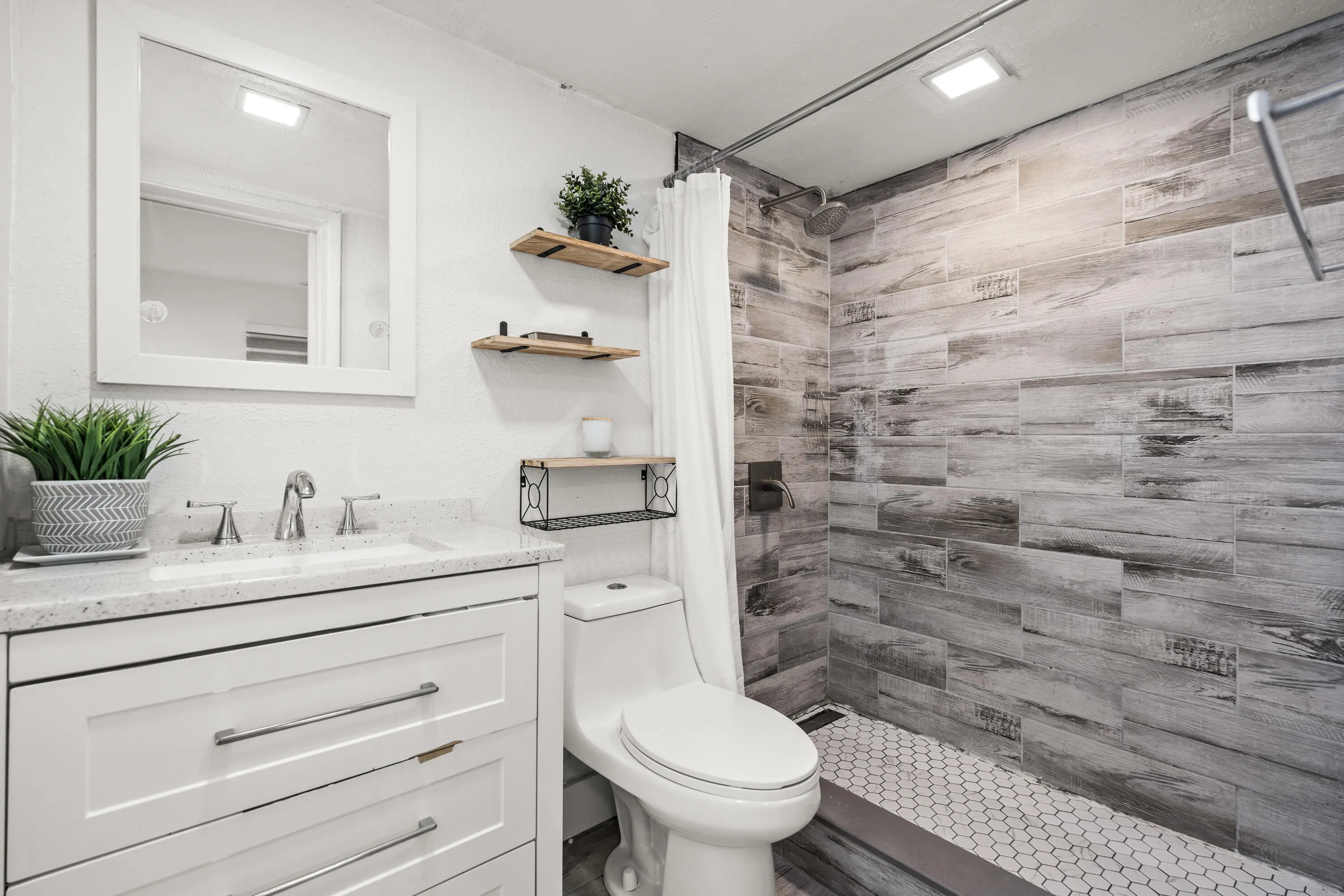 Bathroom 1. In Primary Bedroom with Vanity and Shower