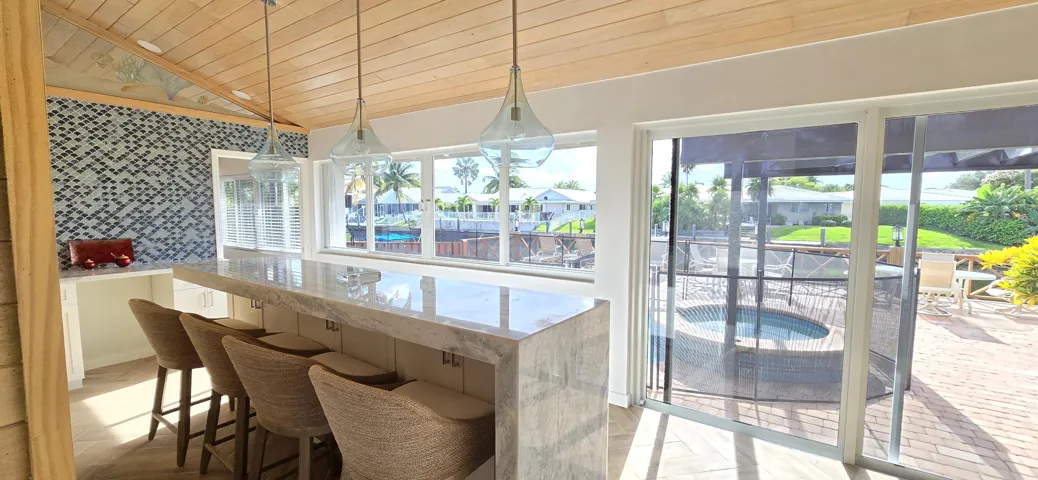 Waterfall bar overlooking pool & water