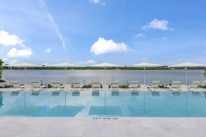 Infinity-edge pool with surrounding light-toned paving