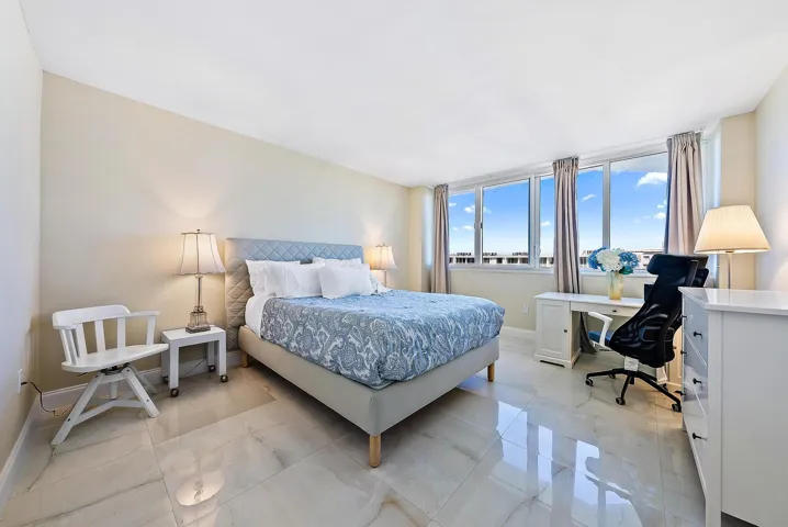 Expansive windows, high ceilings, and light-toned walls