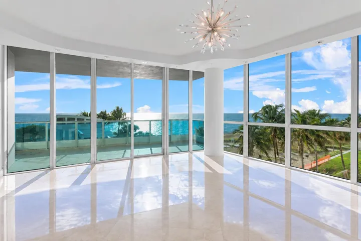 Sunlit Coastal Living Room with Ocean Vi