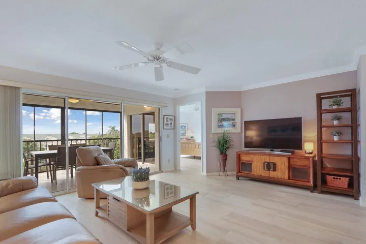 Living room with 3-panel glass slider door to Lanai