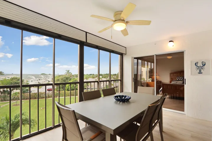 Lanai and 2-panel glass sliding goor to primary bedroom Roll-down rain screen with support bars