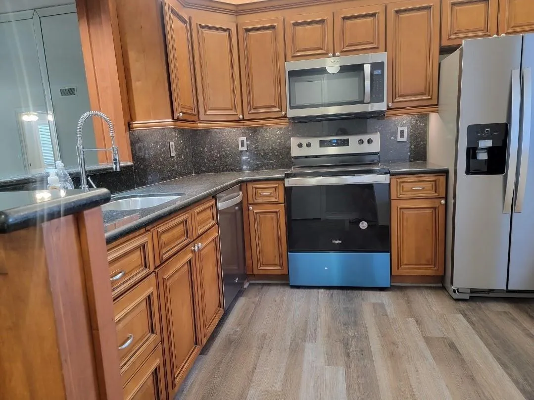 Wood-finish flooring paired with rich wood cabinetry