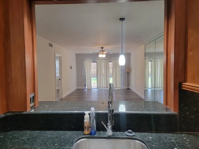 Wood-finish cabinetry framing a pass-through opening