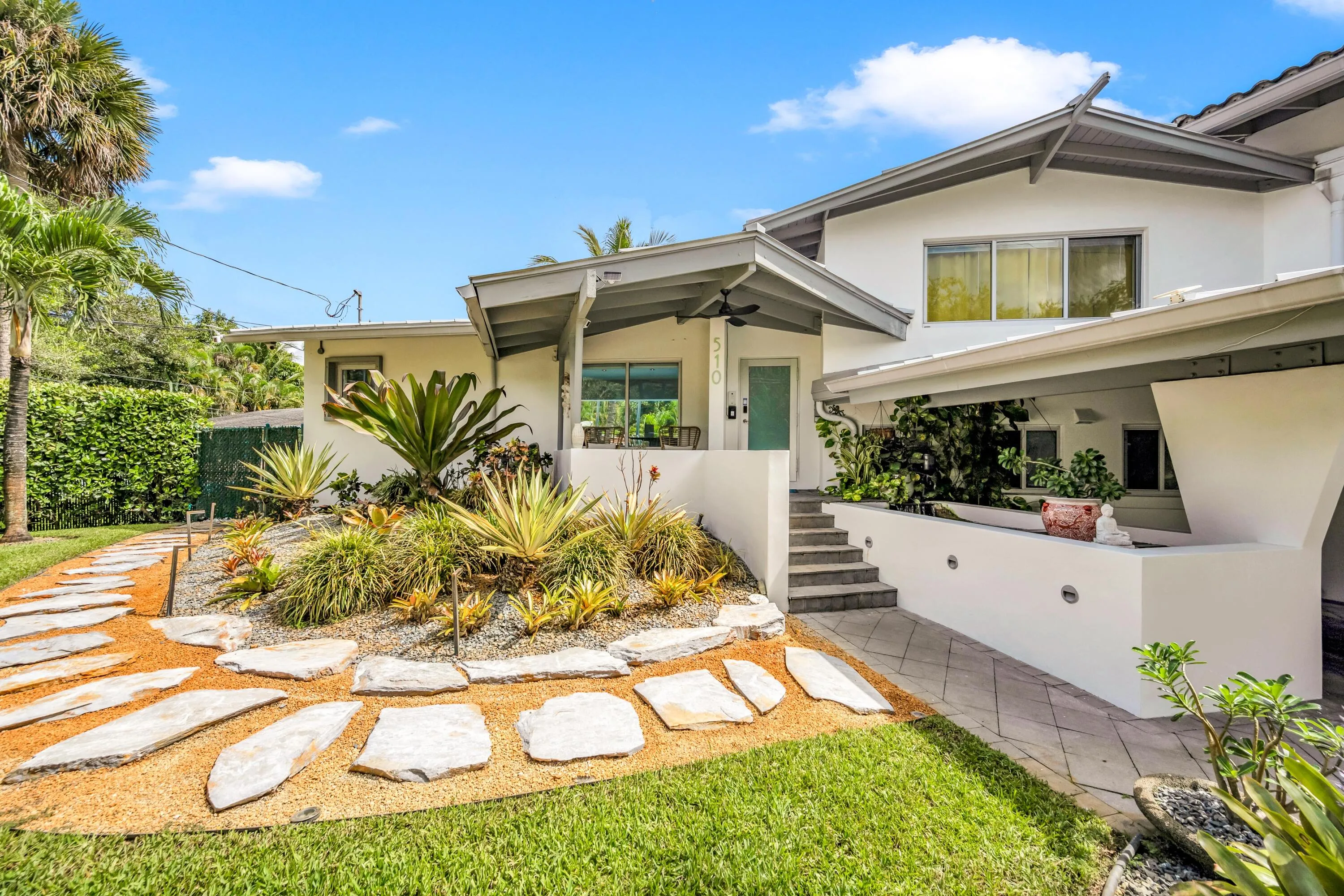 Modern exterior featuring white stucco and gray trim accents