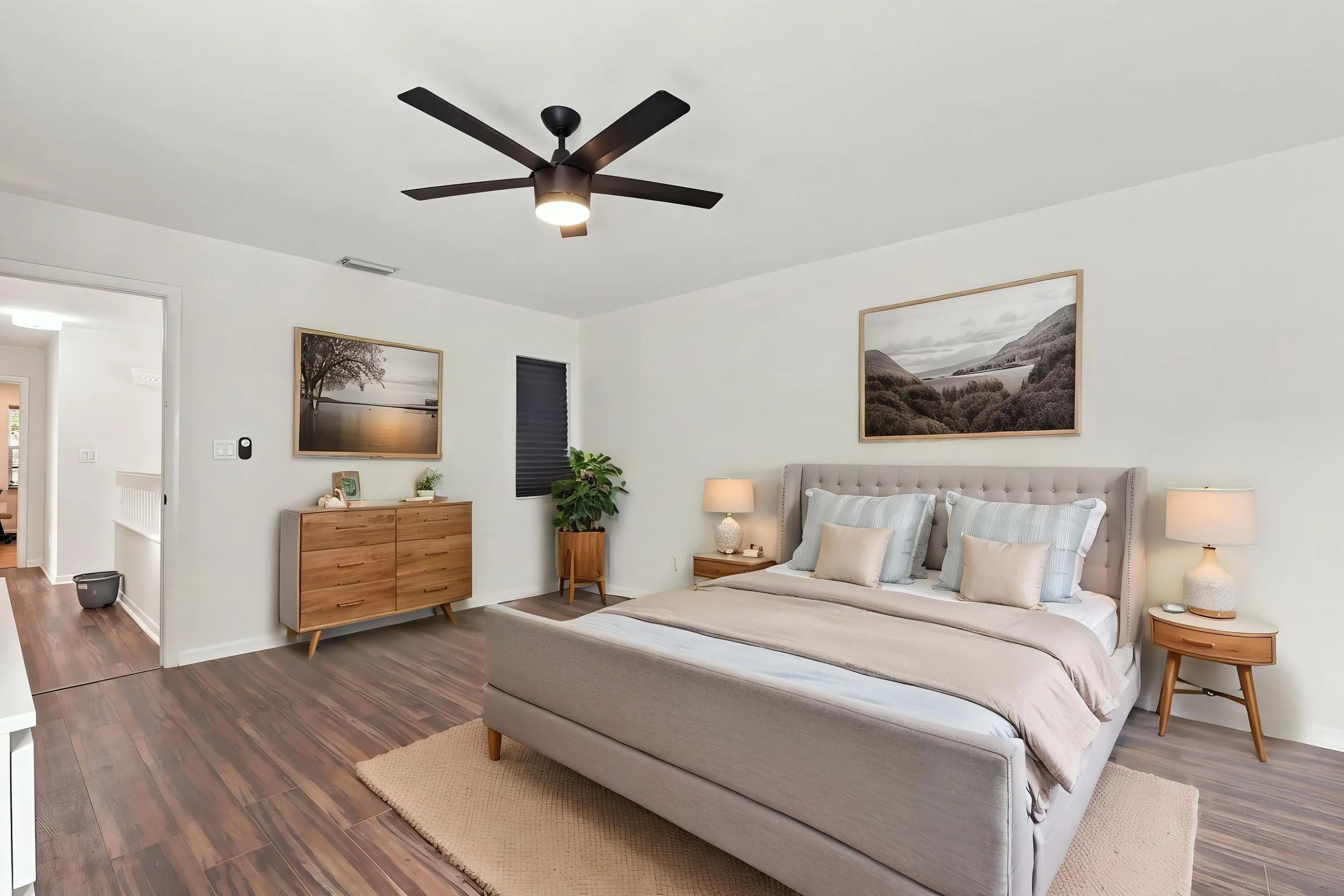 The elegant primary suite offers a private retreat with a beautifully updated bathroom, spacious walk-in closets, and a private balcony overlooking the backyard. It is the perfect place to enjoy your morning coffee while taking in the peaceful setting and mature trees surrounding the community.