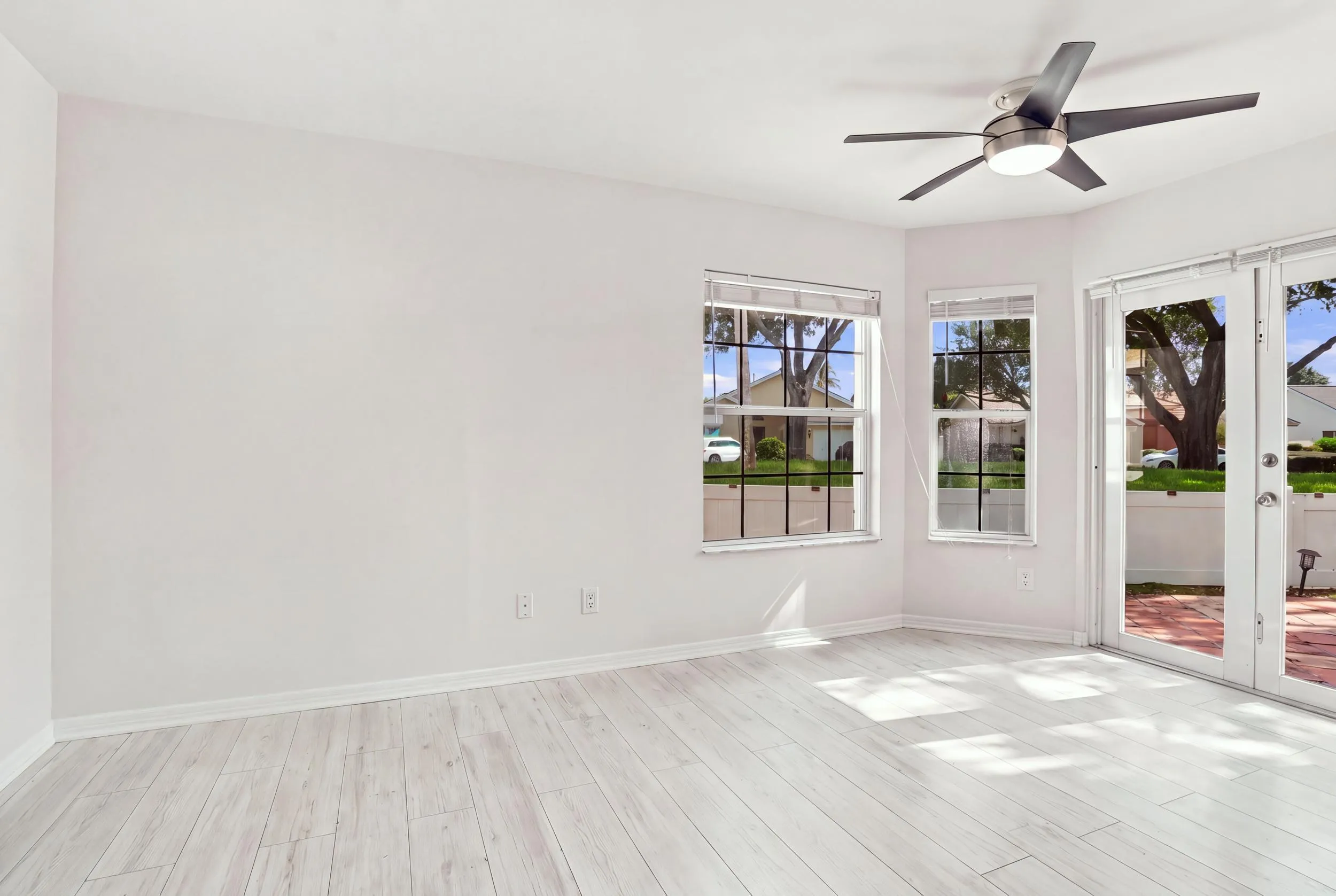 The charming eat-in dining area provides a relaxed and convenient setting for casual meals, surrounded by natural light with sliding glass doors opening to the private patio.
