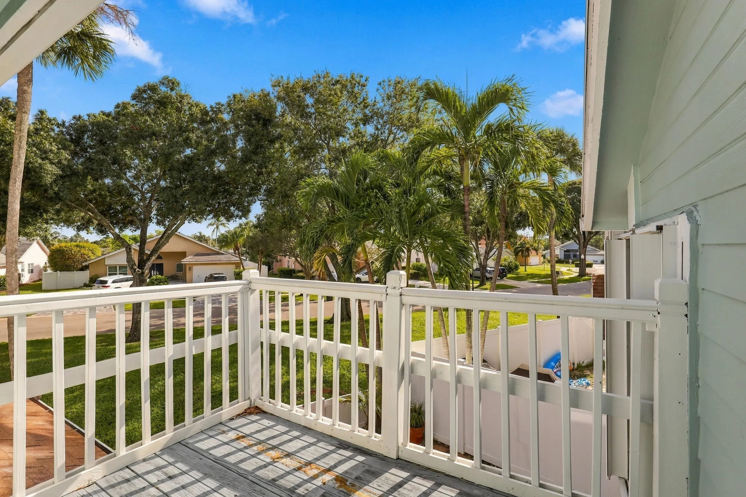 The primary suite’s private balcony offers a peaceful place to begin the day with morning coffee while enjoying views of the backyard and Fairfield’s beautiful mature trees.