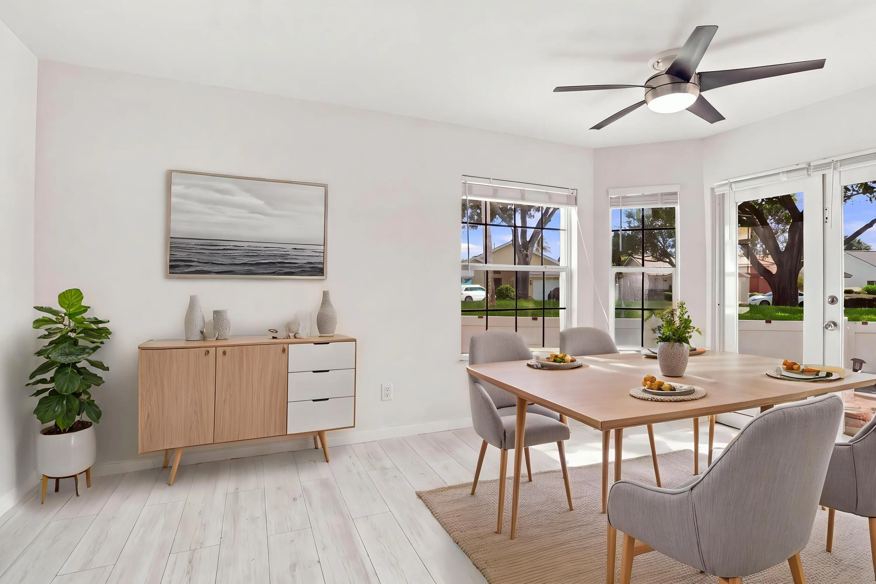 The charming eat-in dining area provides a relaxed and convenient setting for casual meals, surrounded by natural light with sliding glass doors opening to the private patio.