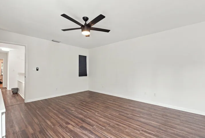 The elegant primary suite offers a private retreat with a beautifully updated bathroom, spacious walk-in closets, and a private balcony overlooking the backyard. It is the perfect place to enjoy your morning coffee while taking in the peaceful setting and mature trees surrounding the community.