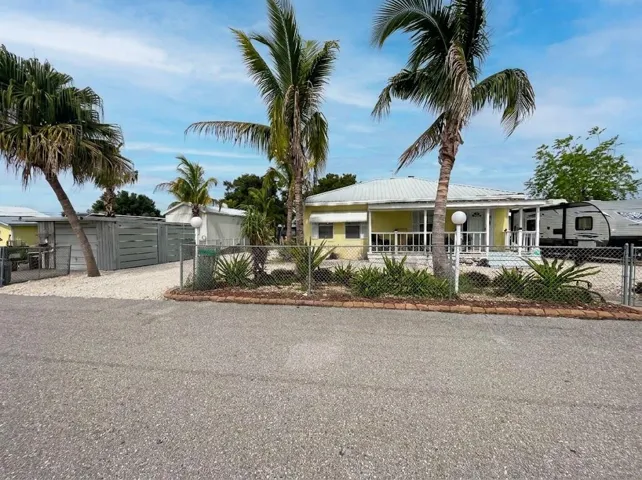 Double lot with outbuildings. 1/3rd acre.