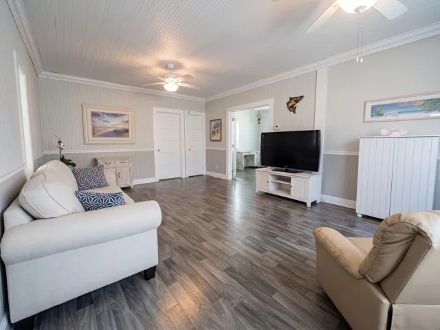 Spacious living room with high ceilings and crown molding