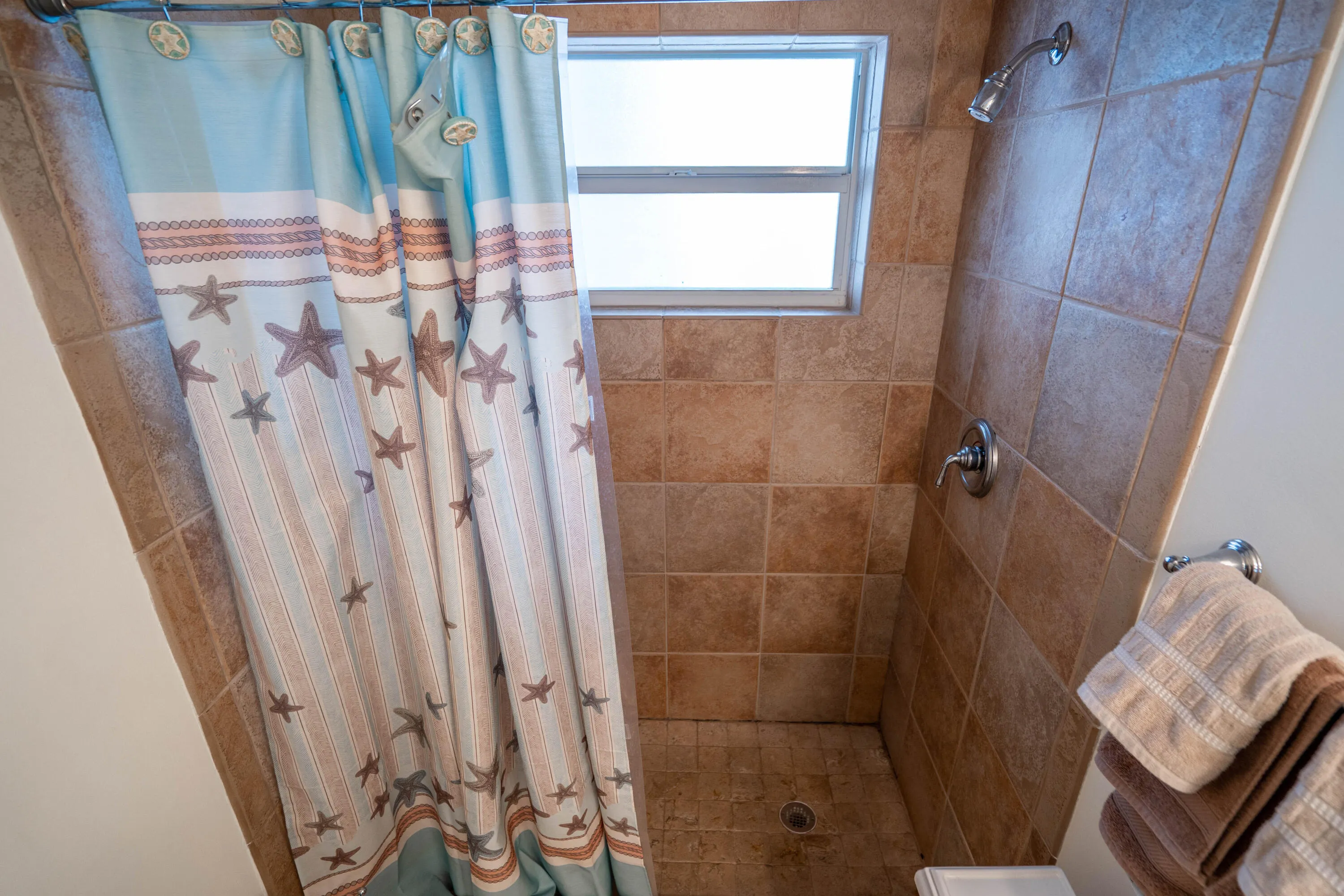 Shower with tile surround and integrated window