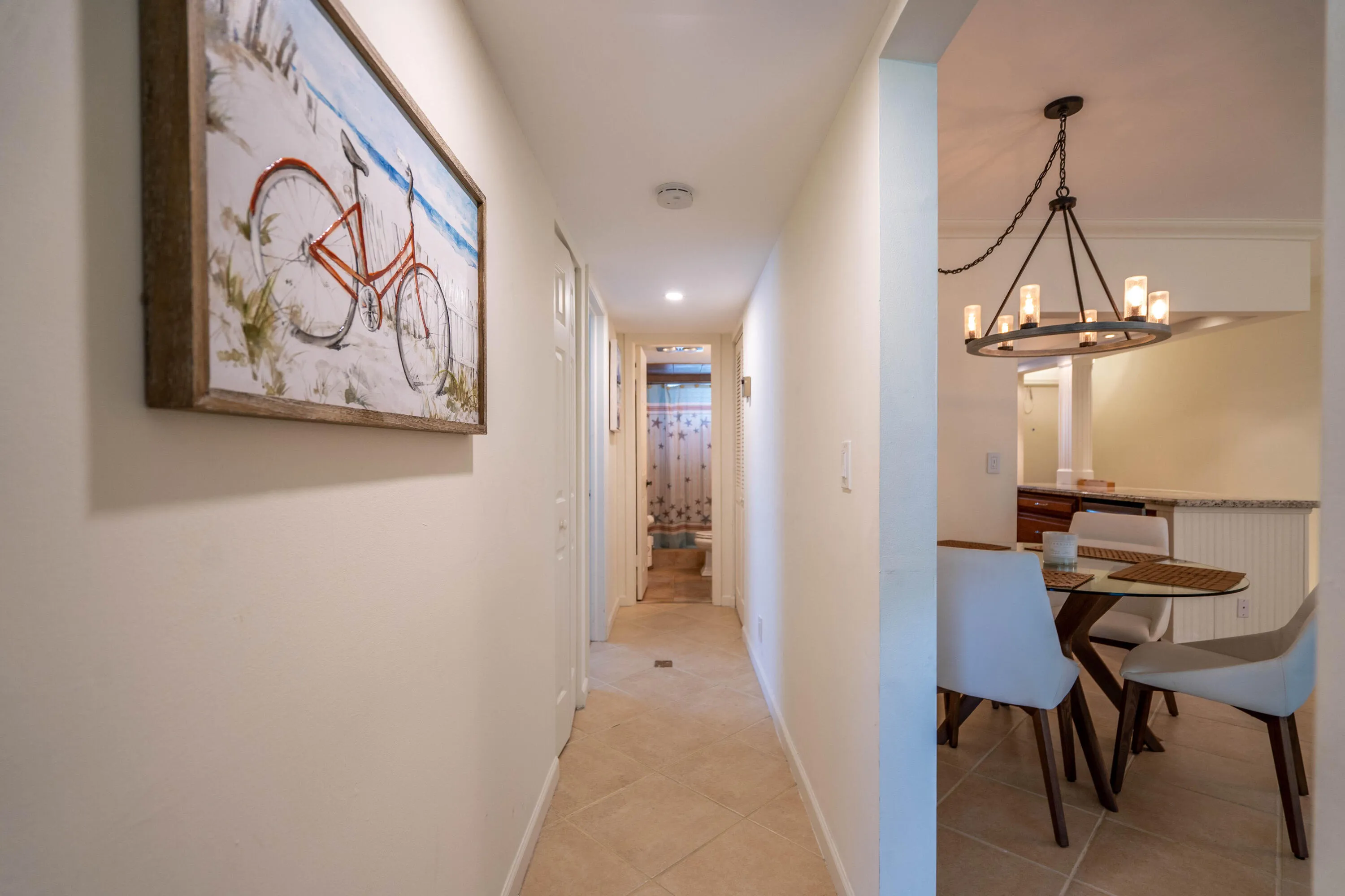 Hallway featuring tile flooring and neutral wall tones