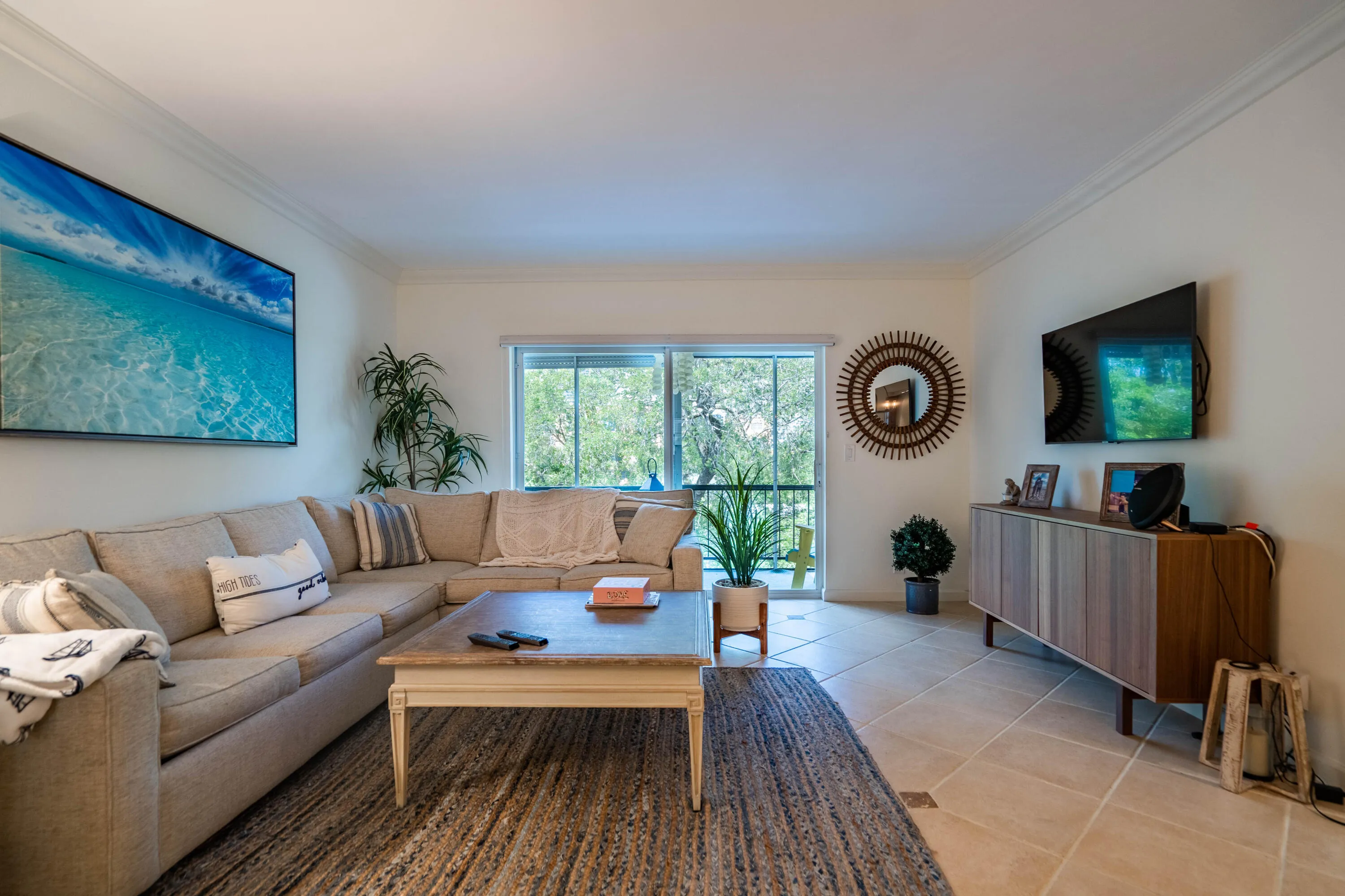 Crown molding, tile flooring, and sliding glass doors
