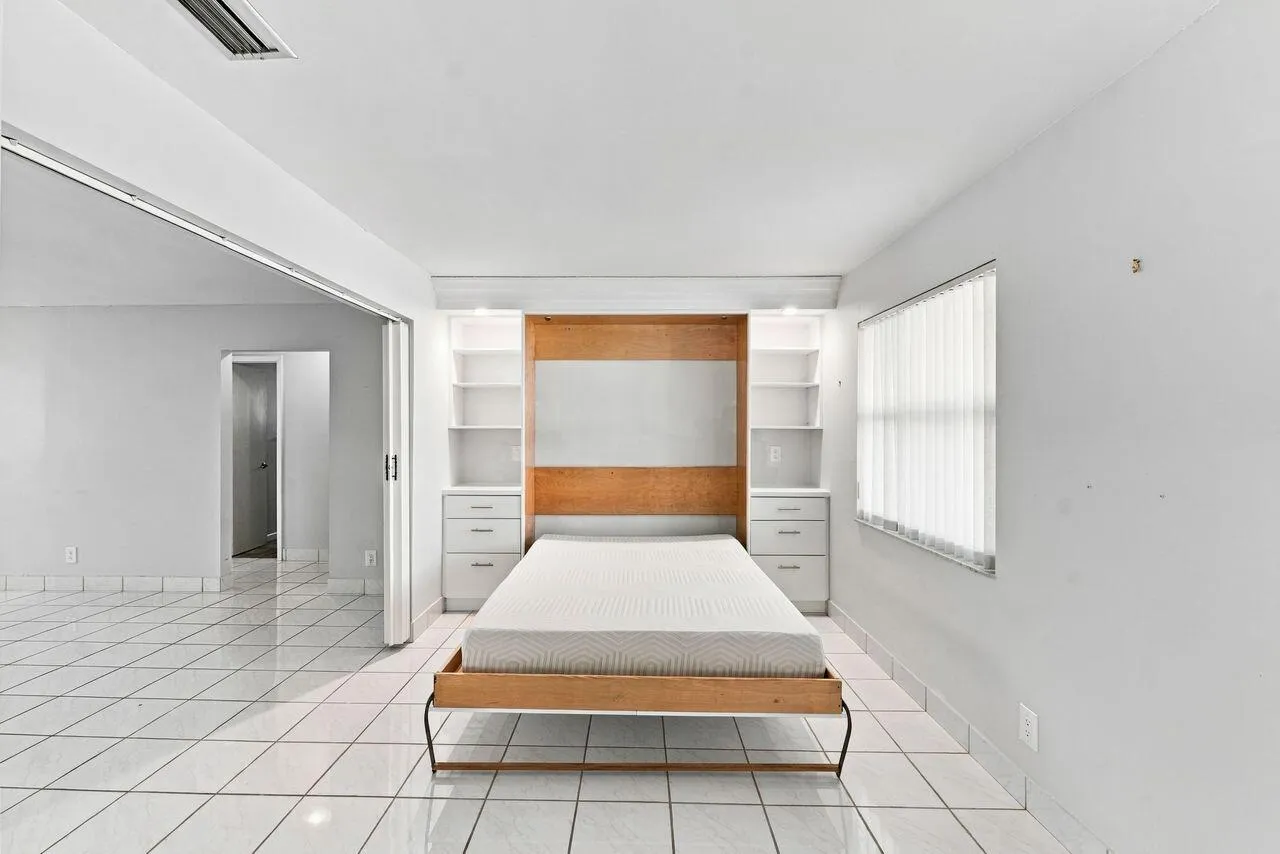 Beautiful built in Murphy bed with custom bookshelves for extra sleeping space