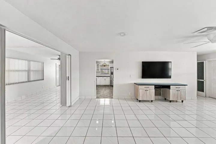 Large and open living room adjoining kitchen and family room