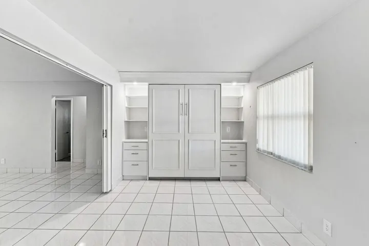 Large living space with a gorgeous Murphy Bed & Bookshelves for extra sleeping accommodations