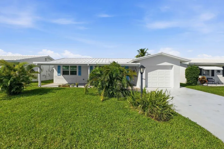 Move in ready 2/2 with attached garage, and a paved and extended driveway