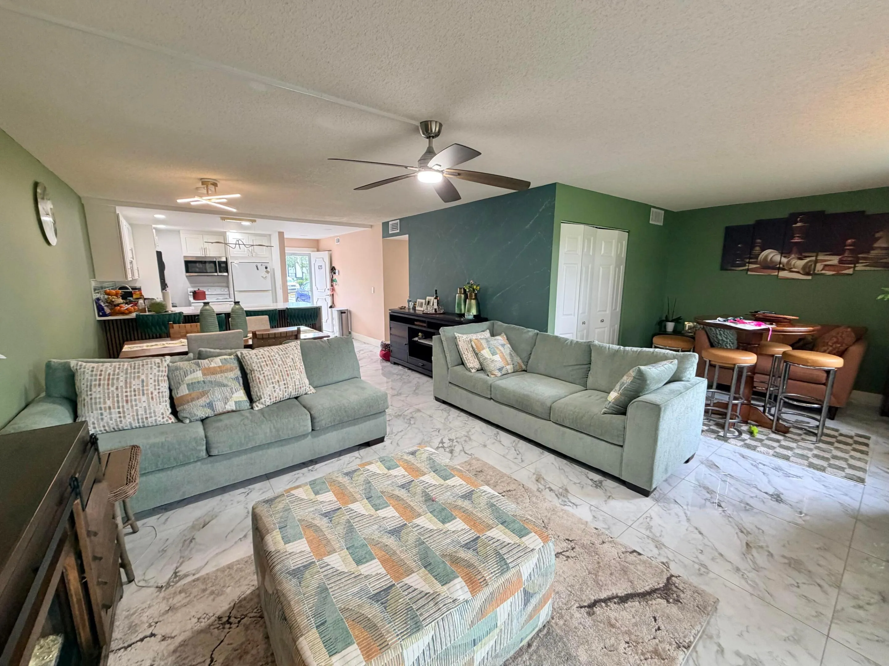 Living room to dining area to kitchen