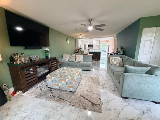 Living room to dining area to kitchen