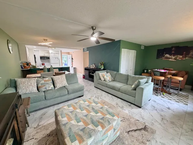 Living room to dining area to kitchen