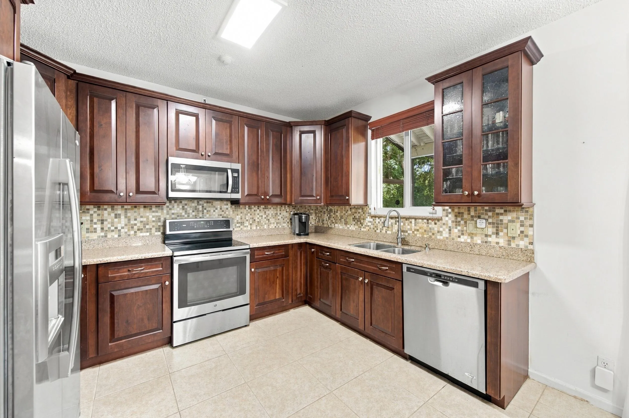 Wood-finish cabinetry paired with light-toned countertops