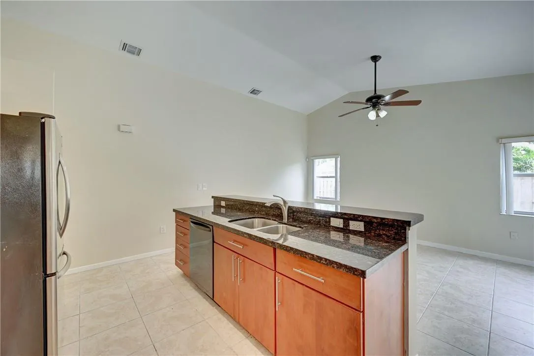 Everyone loves the Island. Sink overlooks family room