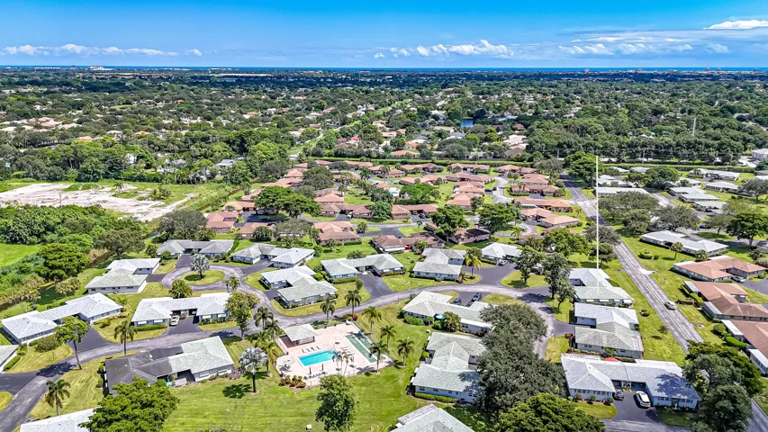 Aerial perspective showcasing a residential community with mature landscaping