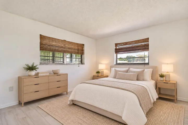 Light-toned wood-finish flooring with white walls