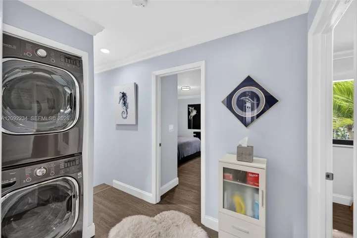 Full Size Stackable Washer and Dryer Were Moved from the Two Car Garage for Convenience and More Space in the Garage