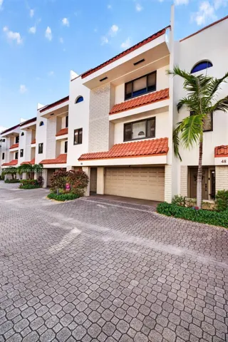 Traditional Terra Cota Barrel Tile Accents Gives the Complex a Classic Florida Look