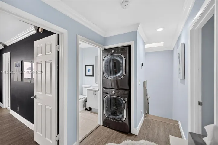 Stacked High-End Washer and Dryer Were Installed Upstairs Next to the Bedrooms for Convenience