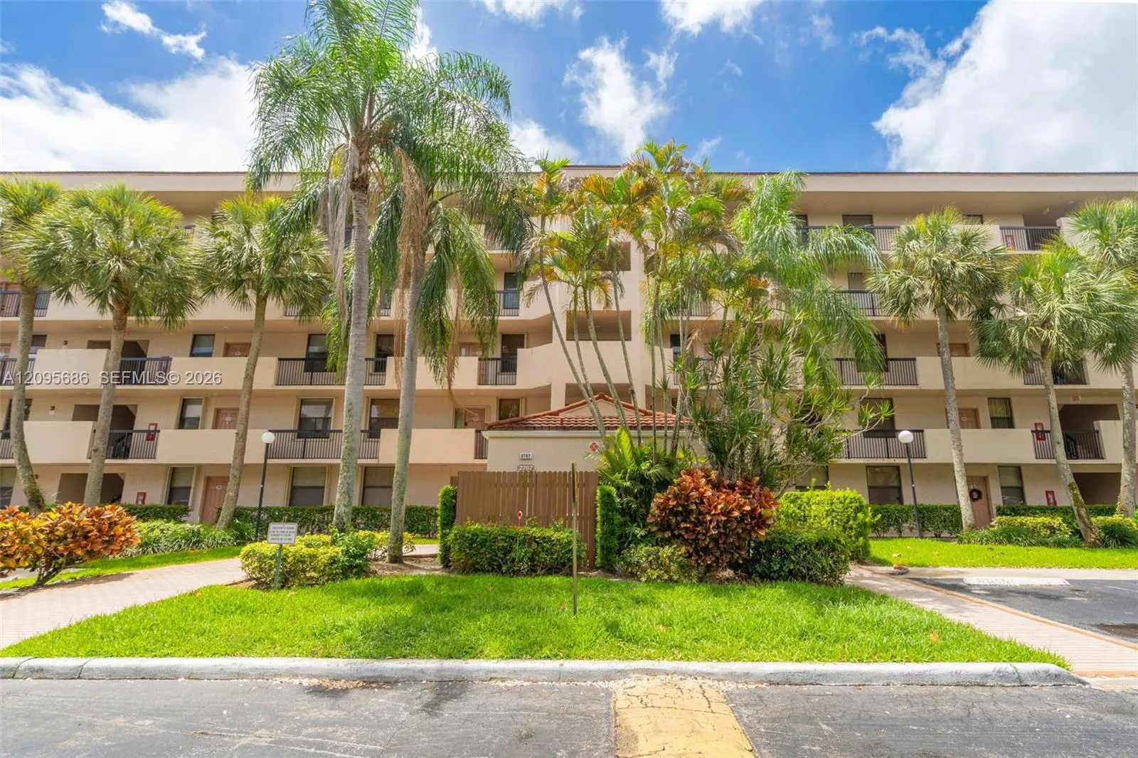 Well-maintained community building surrounded by mature landscaping.