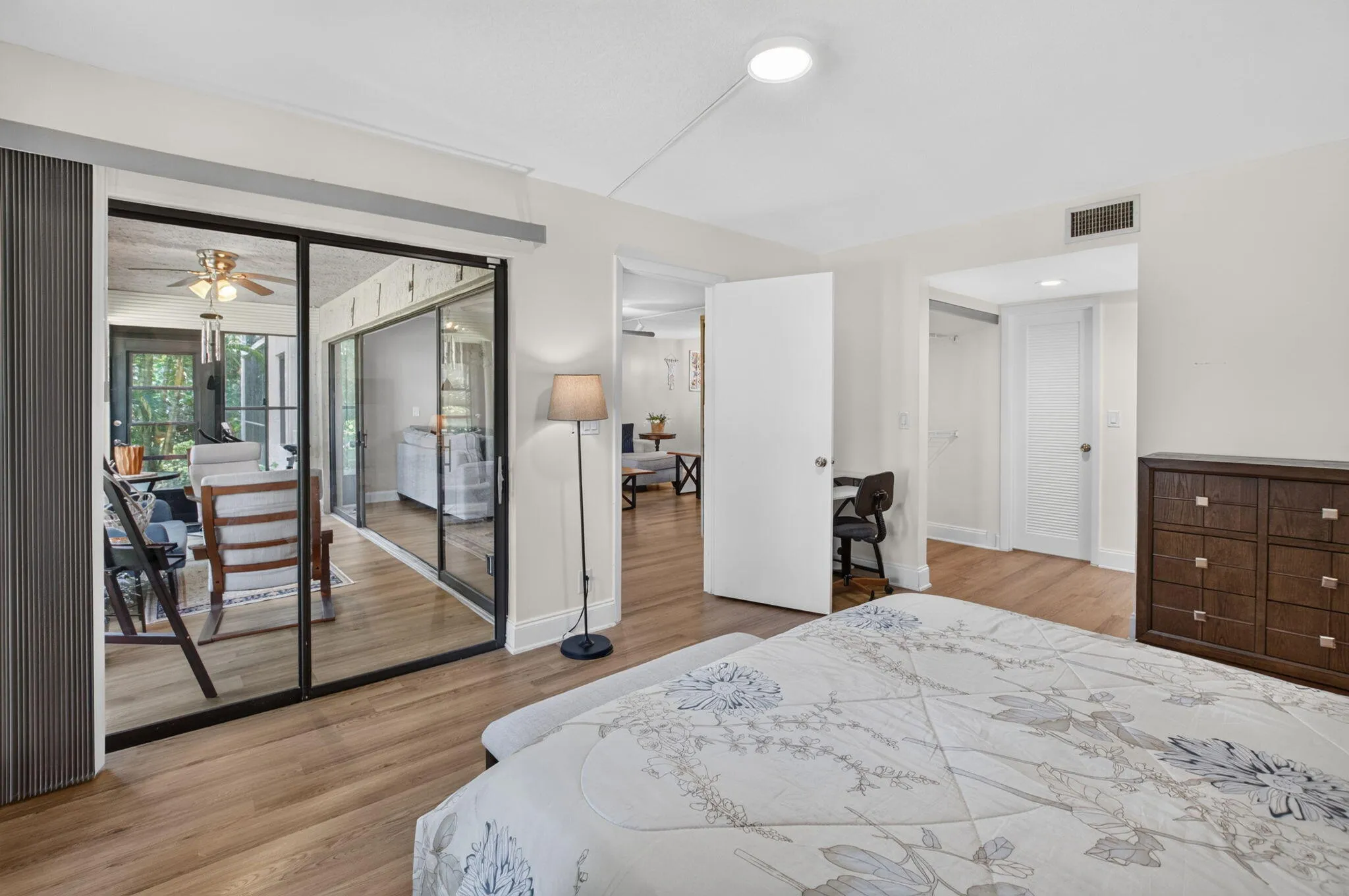 Queen sized bed, wall closet, walk-in closet and access to the Florida room