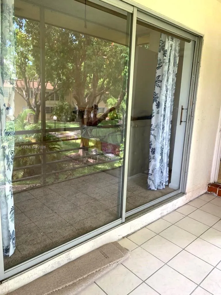 BEDROOM SLIDERS TO SCREENED TILED PATIO WATER VIEW