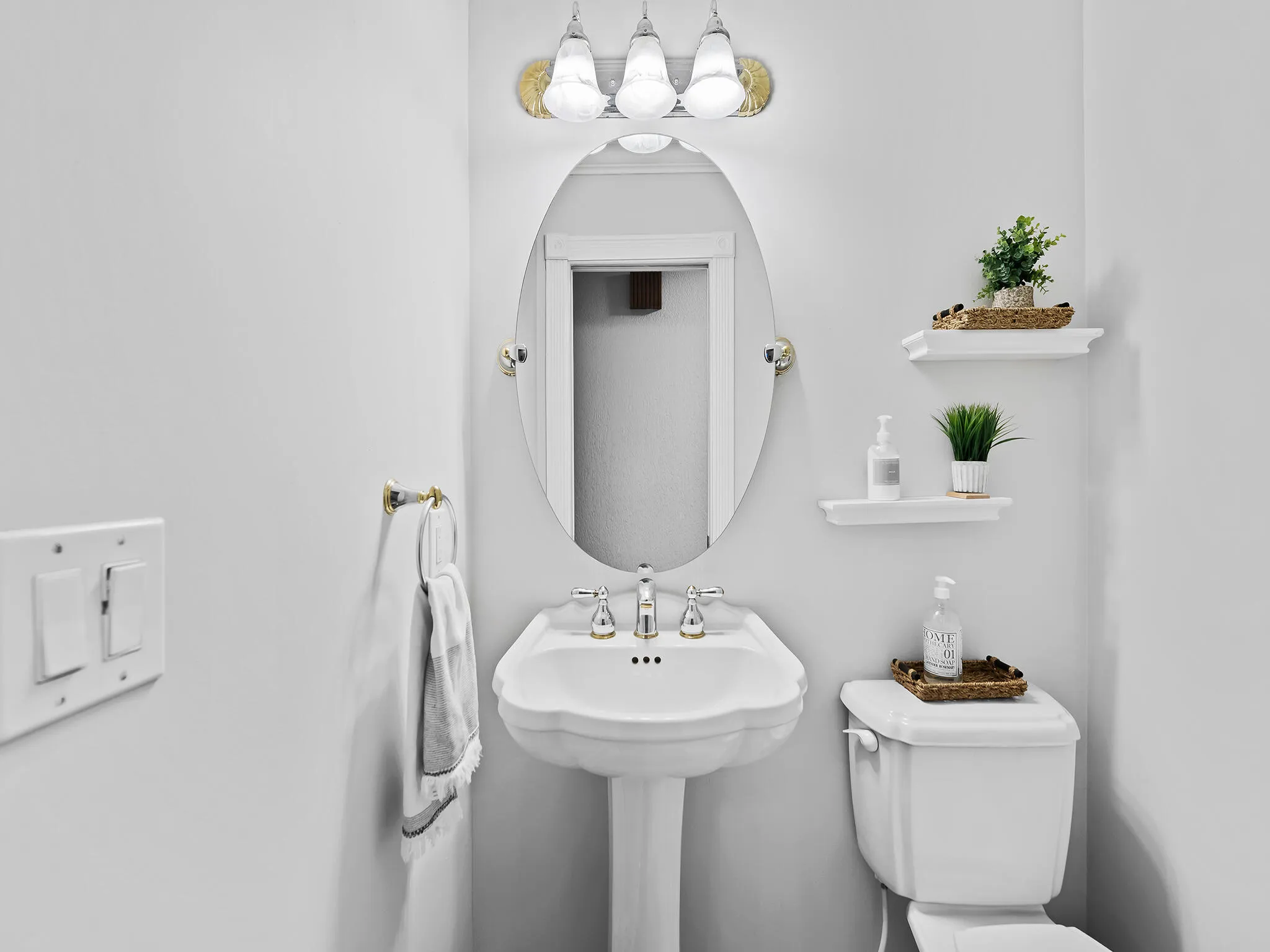 Powder room with classic pedestal charm.