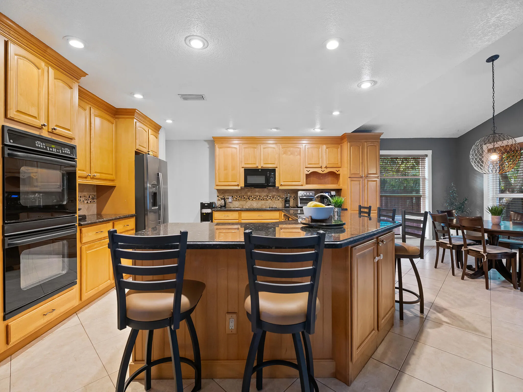 Two toned island with casual bar seating.