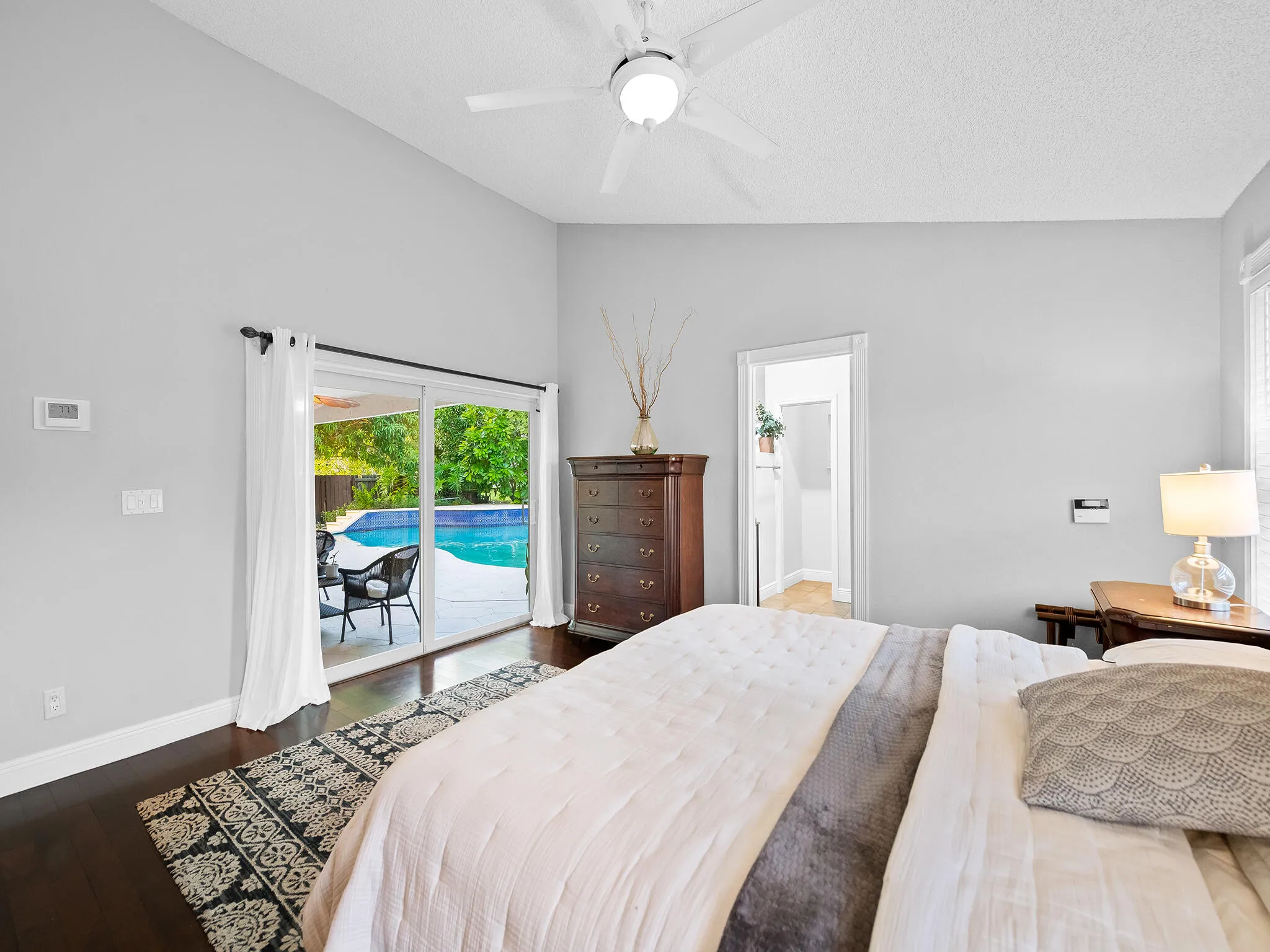 Guest bedroom with direct pool deck access.