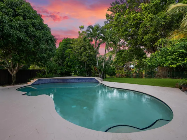 Sunset paints the sky over your private pool.