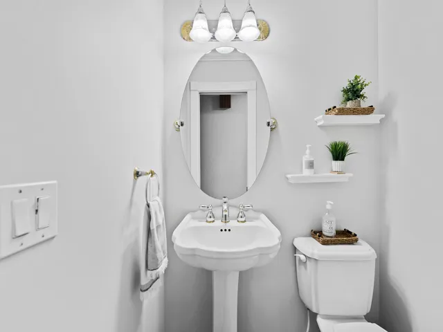 Powder room with classic pedestal charm.