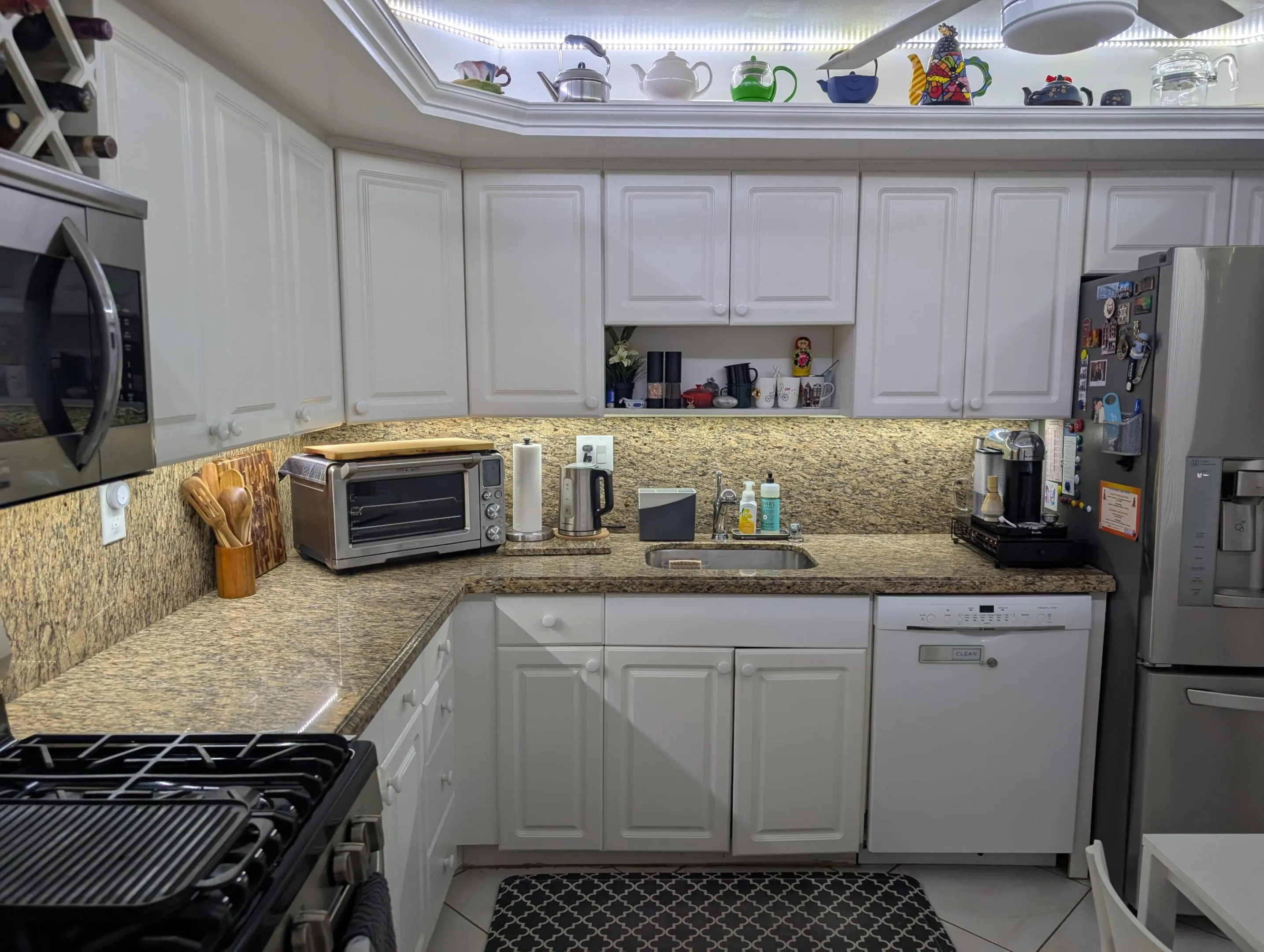 Kitchen Featuring Granite Top & Stainless Steel Appliances