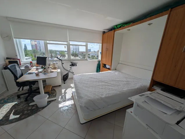 Second Bedroom featuring an office and a murphy Bed