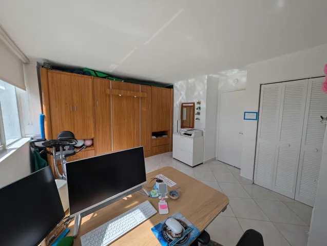 Second Bedroom featuring an office and a murphy Bed