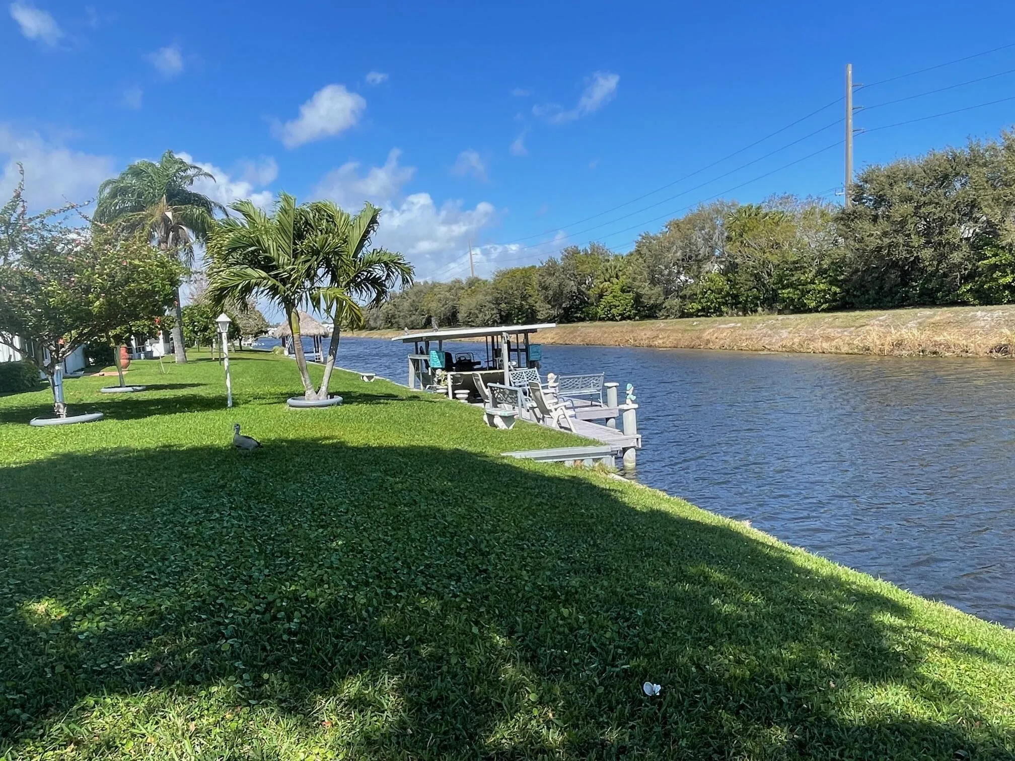 VIEW OF NEXT DOOR NEIGHBORS DOCK AND CANAL