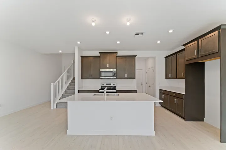 Stock photos represent builder's floorplan