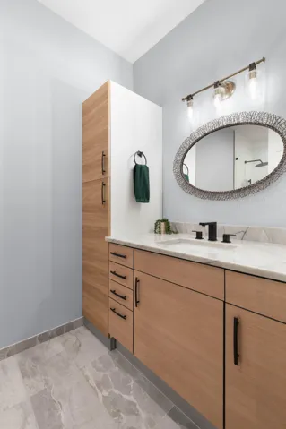 A fresh, modern ensuite bath gives upstairs guests their own beautifully finished space to get ready and feel right at home.