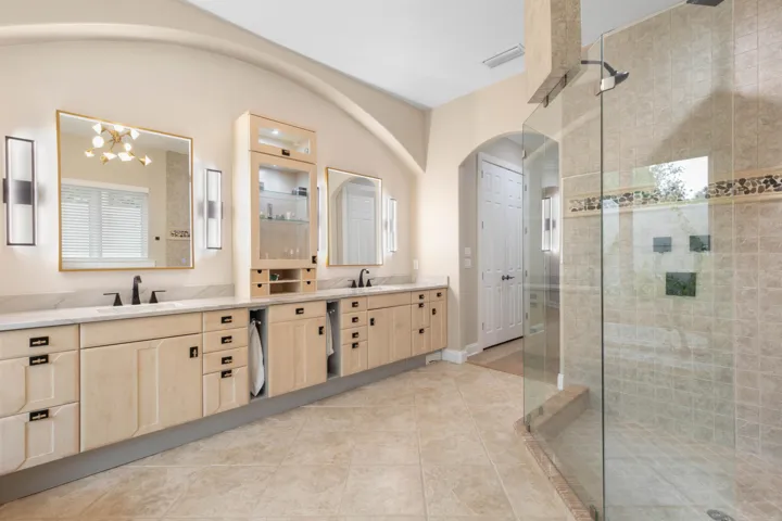 Plenty of room for two—and no fighting over the sink. Dual vanities, abundant storage make busy mornings feel effortless.